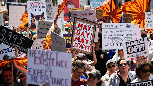 Demonstrators during a May Day immigrant and workers rights rally in Washington, DC, US, on Thursday, May 1, 2025. Federal employee pension benefits are set to be pared back in Republicans' giant tax and spending package working its way through the US House, another slap at a workforce roiled by Elon Musk's cost-cutting efforts. Photographer: Graeme Sloan/Bloomberg via Getty Images